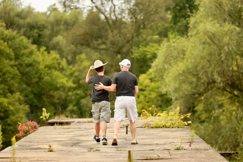 Dad with son on fishing dock