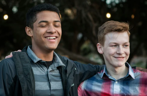 Two teens standing together reminds us of the importance of community in finding mental well being