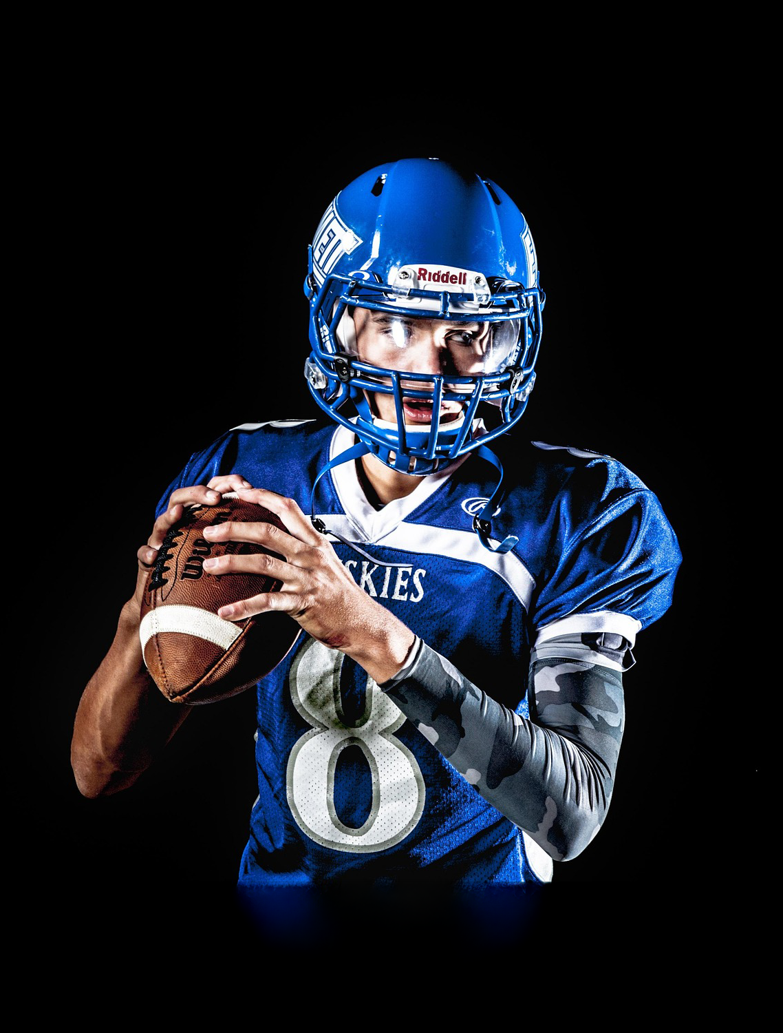 teen playing sport of football