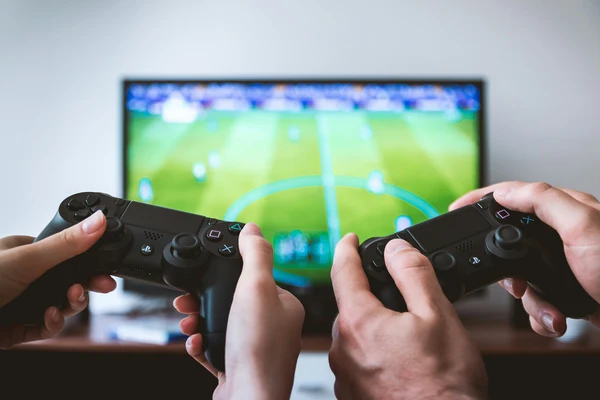 Teen boy choosing video games over school work